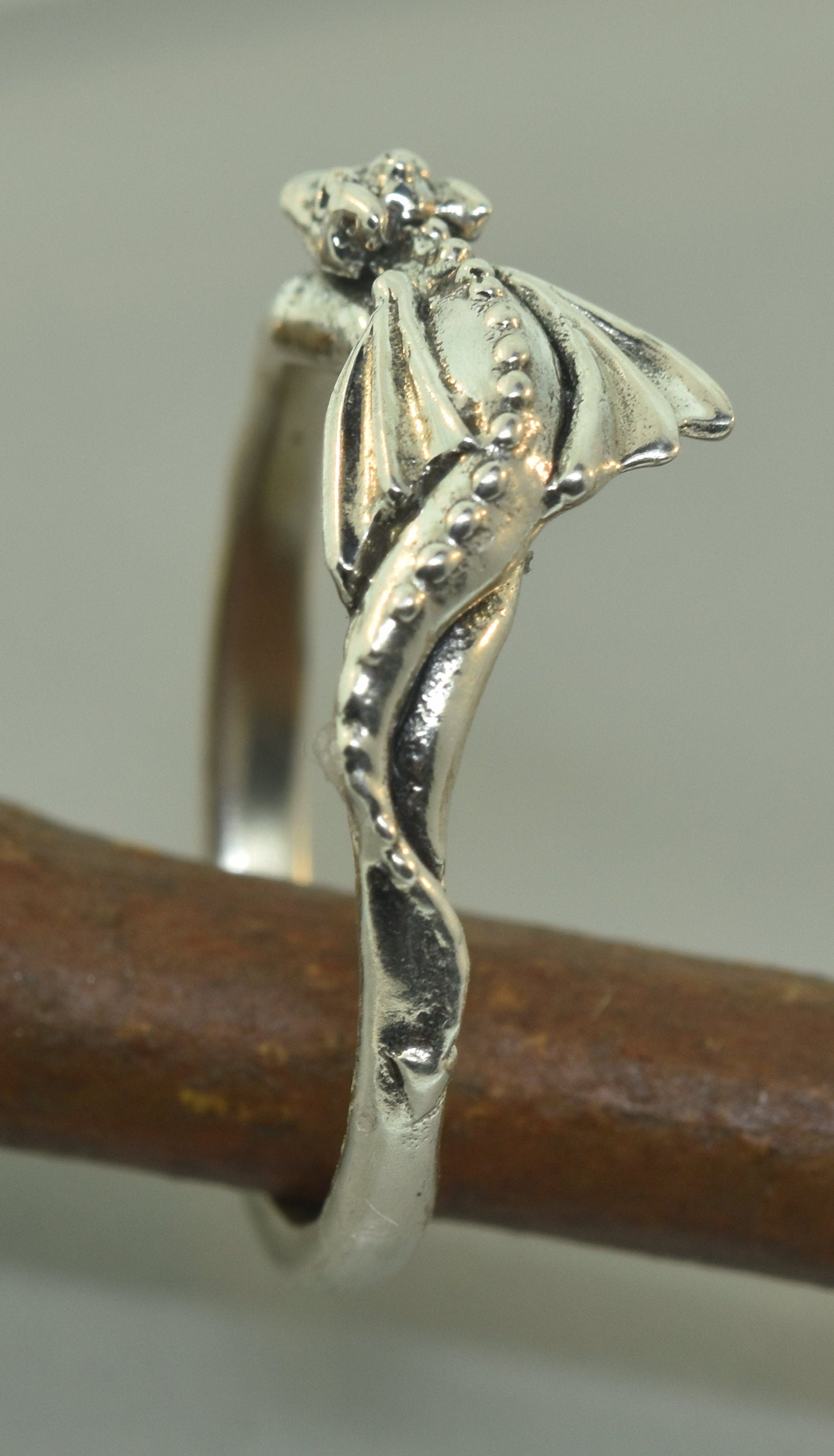 Baby dragon ring with moissanite and green sapphires