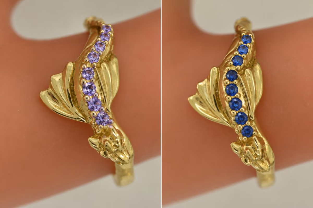 Side-by-side gold Baby Dragon rings with purple amethysts and blue sapphires, showing custom gemstone examples.